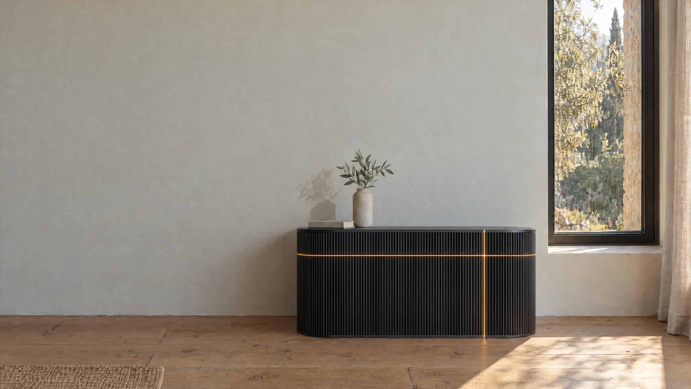 One Wick Ultra in graphite against a plaster wall